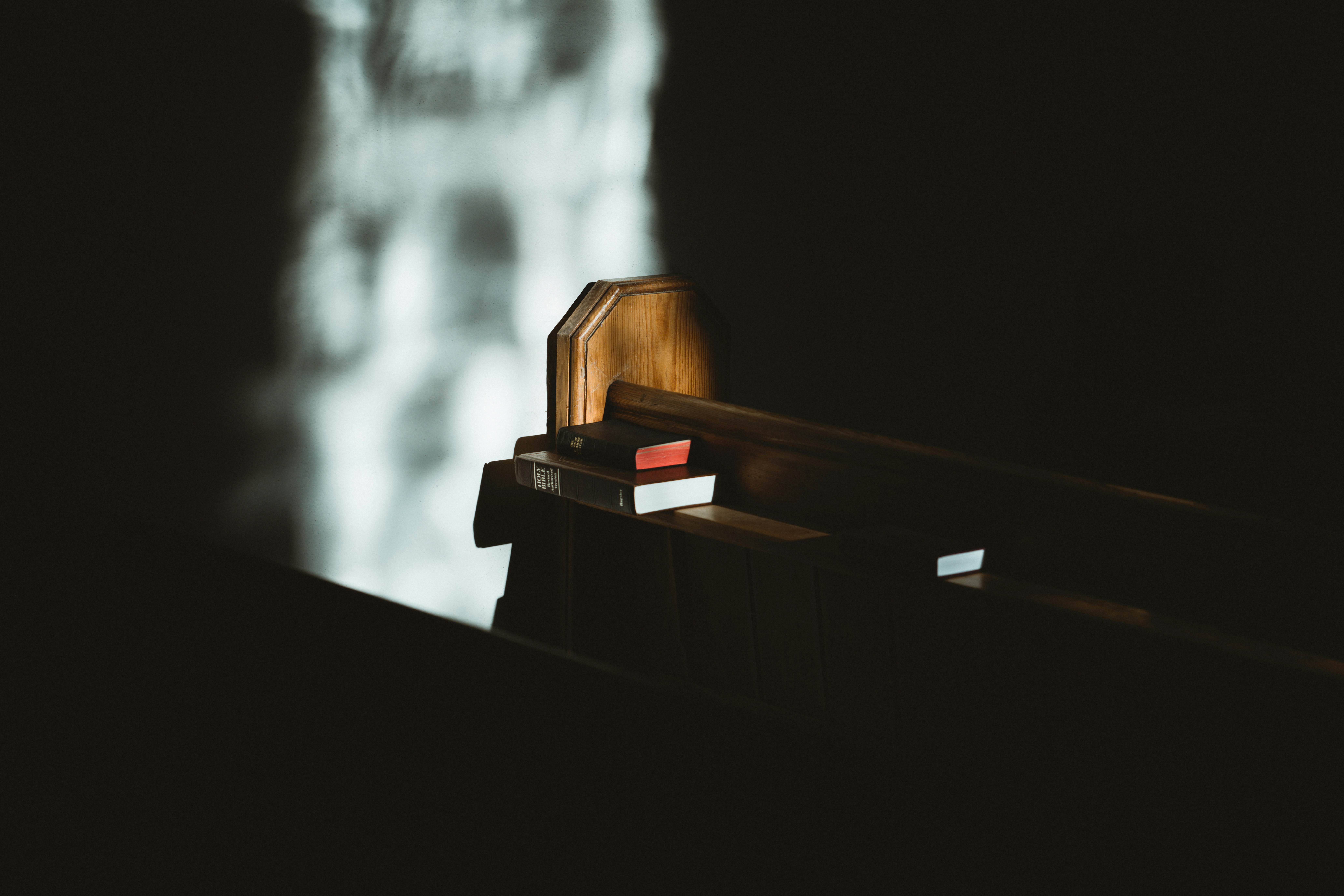 Quiet chapel setting with soft light and a place for reflection and prayer.